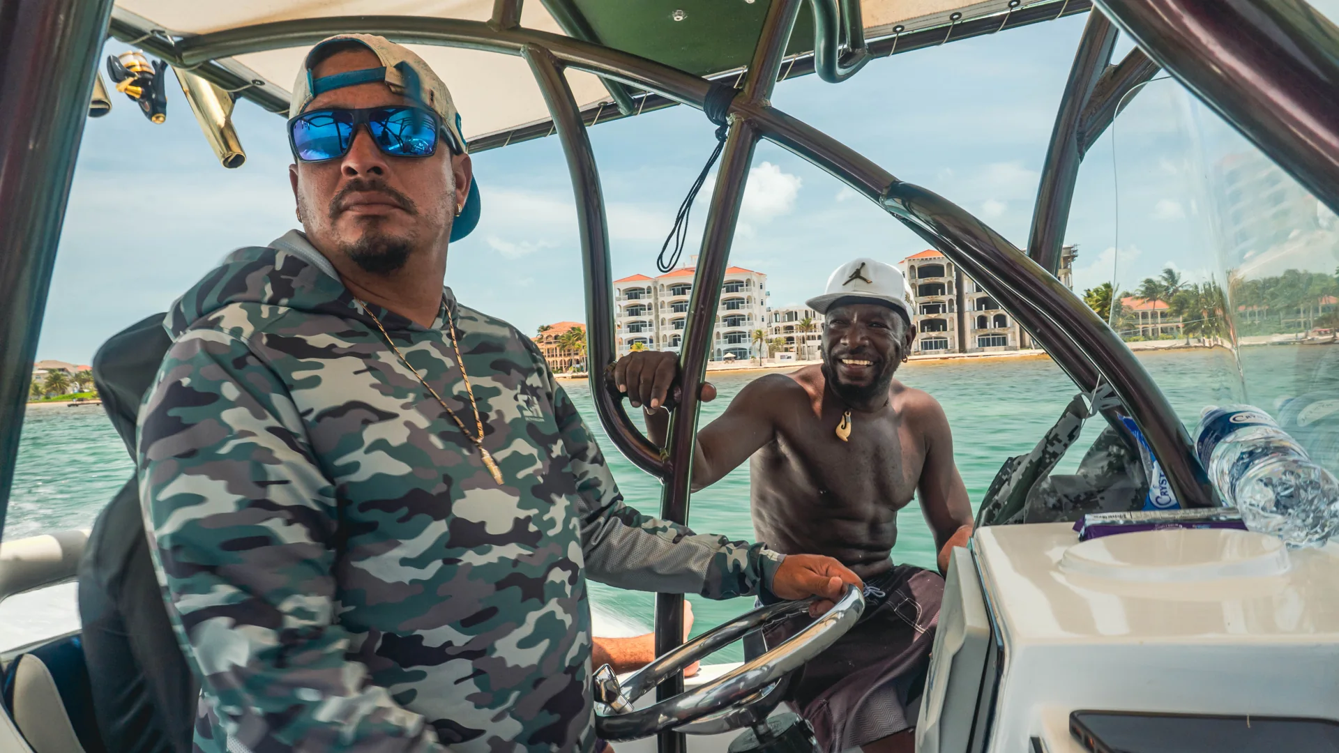 Two members of the Seakarus crew at the helm, with San Pedro behind them